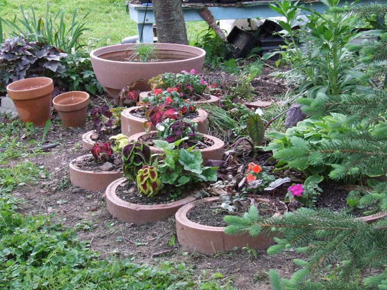 Photo of springtime flowers in circular planters
